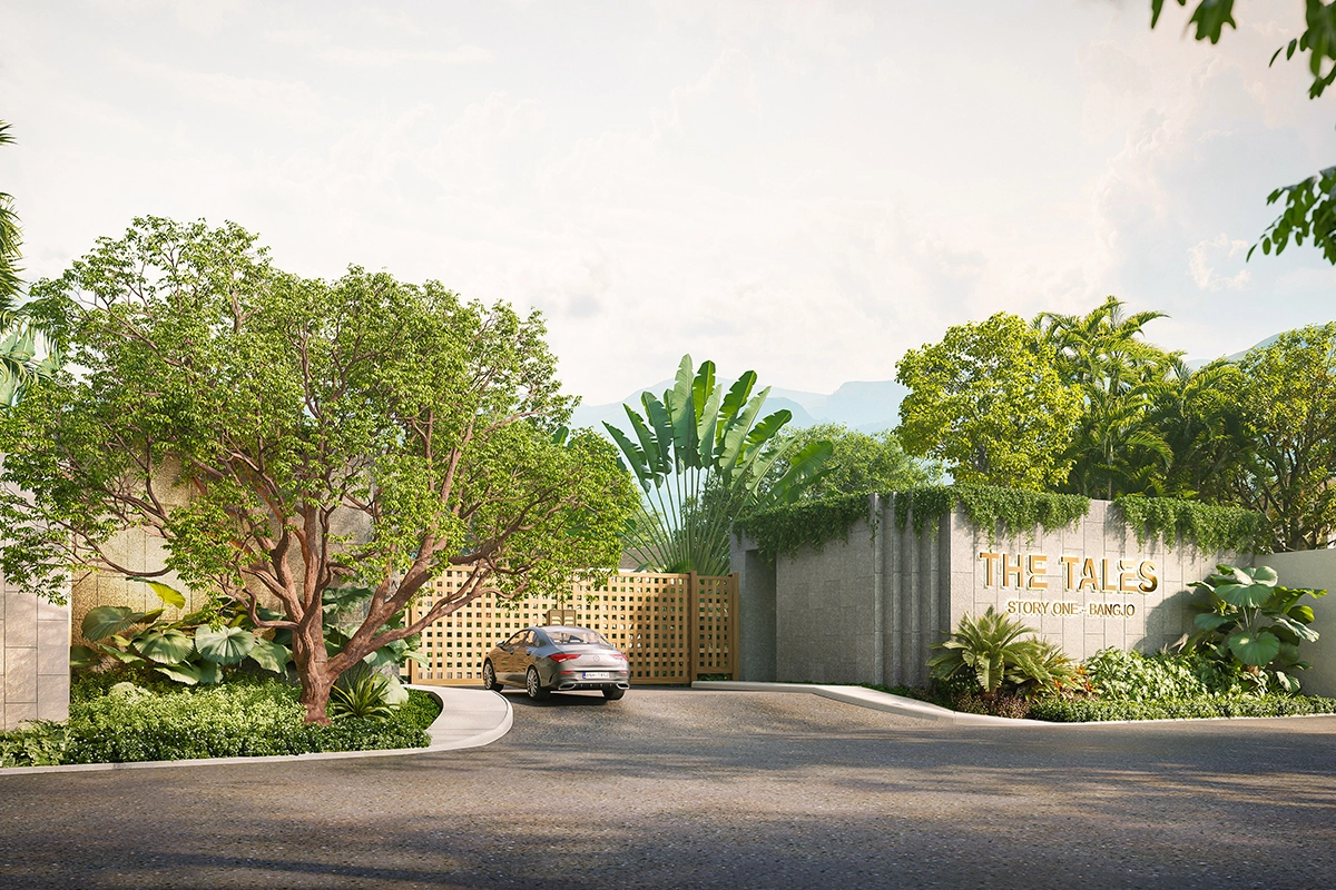A landscaped villa entrance in Bangjo with the green hills of Phuket behind